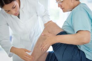 varicose vein massage treatment of a senior woman